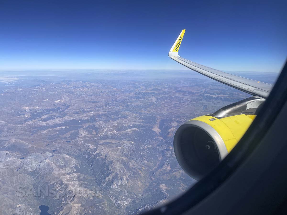 Spirit Airlines A320 engine and wing view while flying over Utah on a clear day
