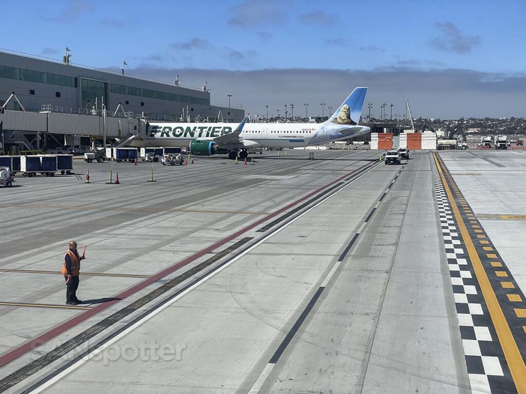 Pulling up to the all new terminal 1 next to a frontier airlines A321 San Diego airport