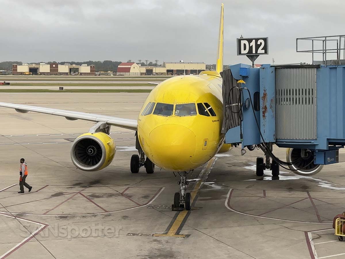 Spirit airlines A320 pulling up to gate D12 at the Evans terminal at DTW