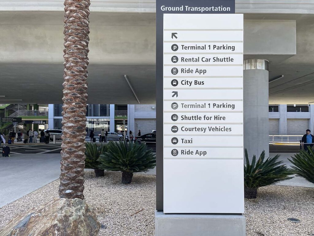 Sign leading to rideshare pick up area terminal 1 San Diego airport
