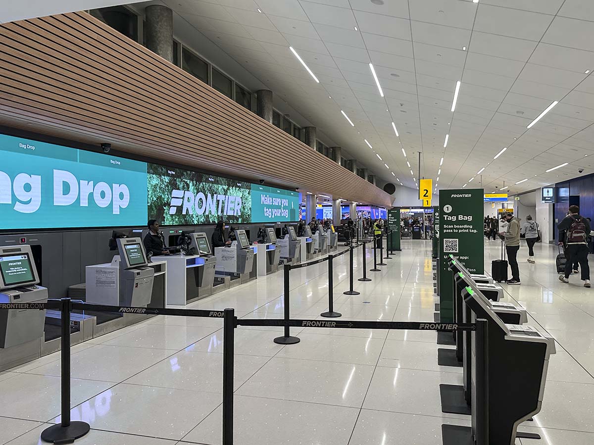 Frontier Airlines check-in area and baggage drop Denver International Airport