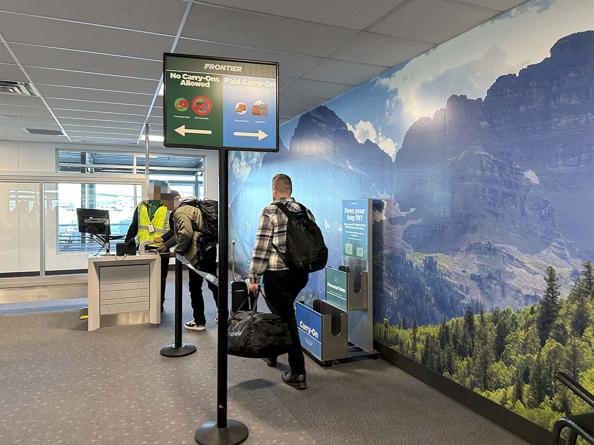 Frontier Airlines upfront plus passengers boarding at gate A79 Denver International Airport