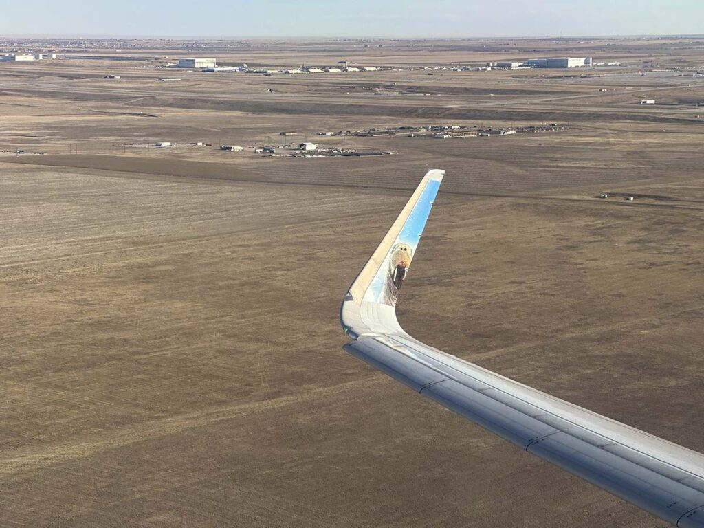 Taking off from runway 25 at DEN in a Frontier Airlines A321
