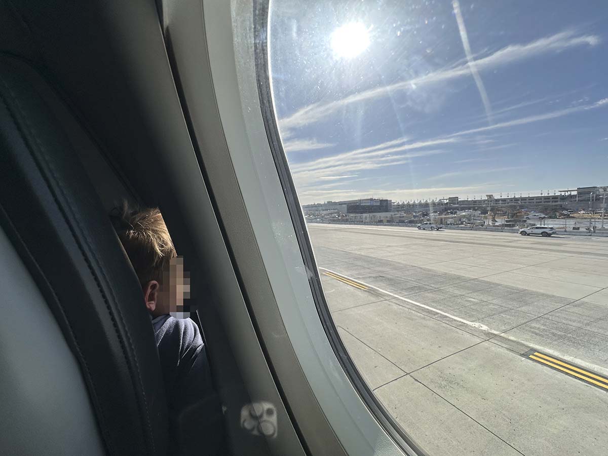 Looking out the window of a Frontier Airlines A321 while pulling up to terminal 1 at the San Diego airport