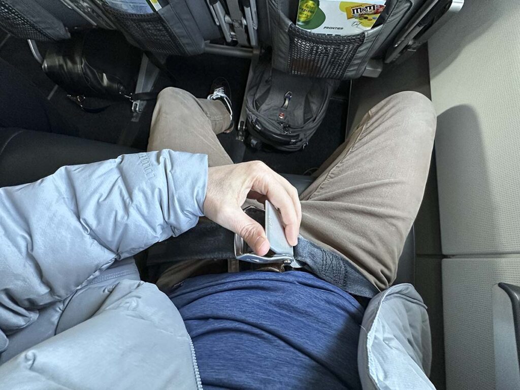 Unbuckling my seatbelt in Frontier Airlines A321 UpFront Plus