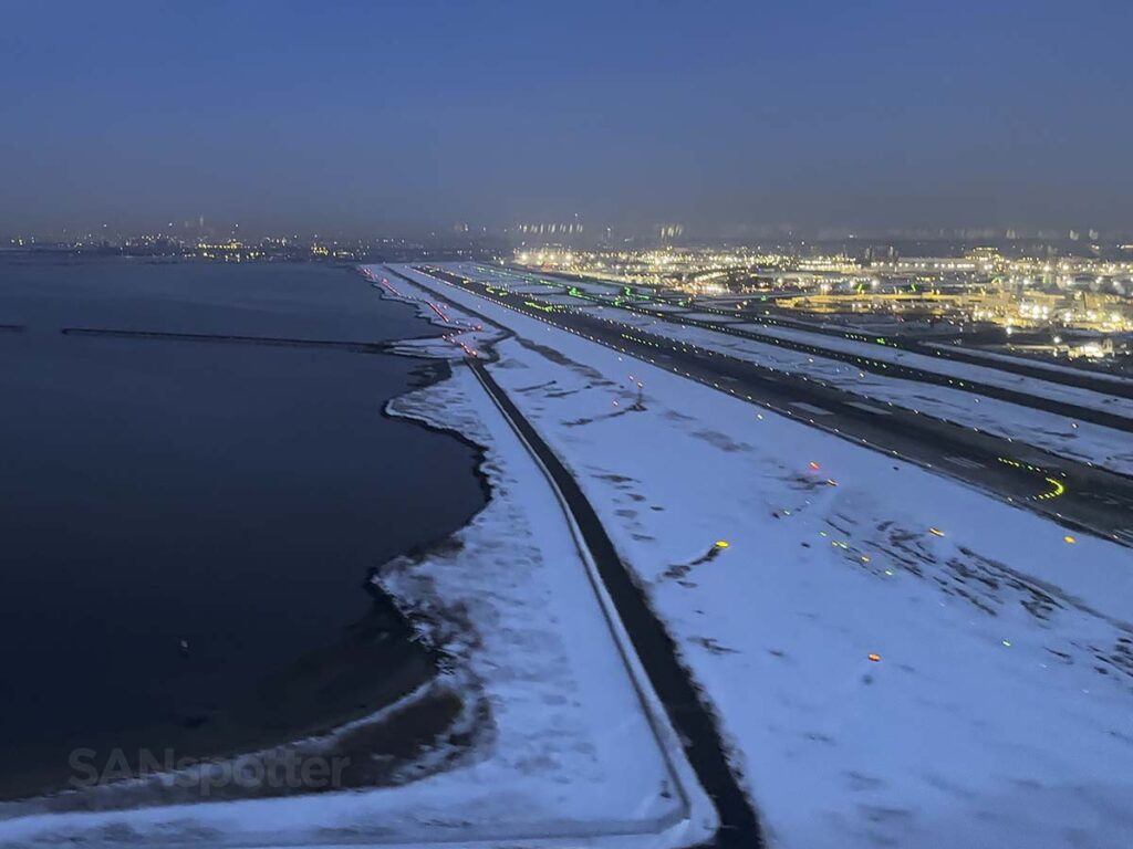 View of JFK Airport just moment after taking off from runway 22R at sunrise in the winter time