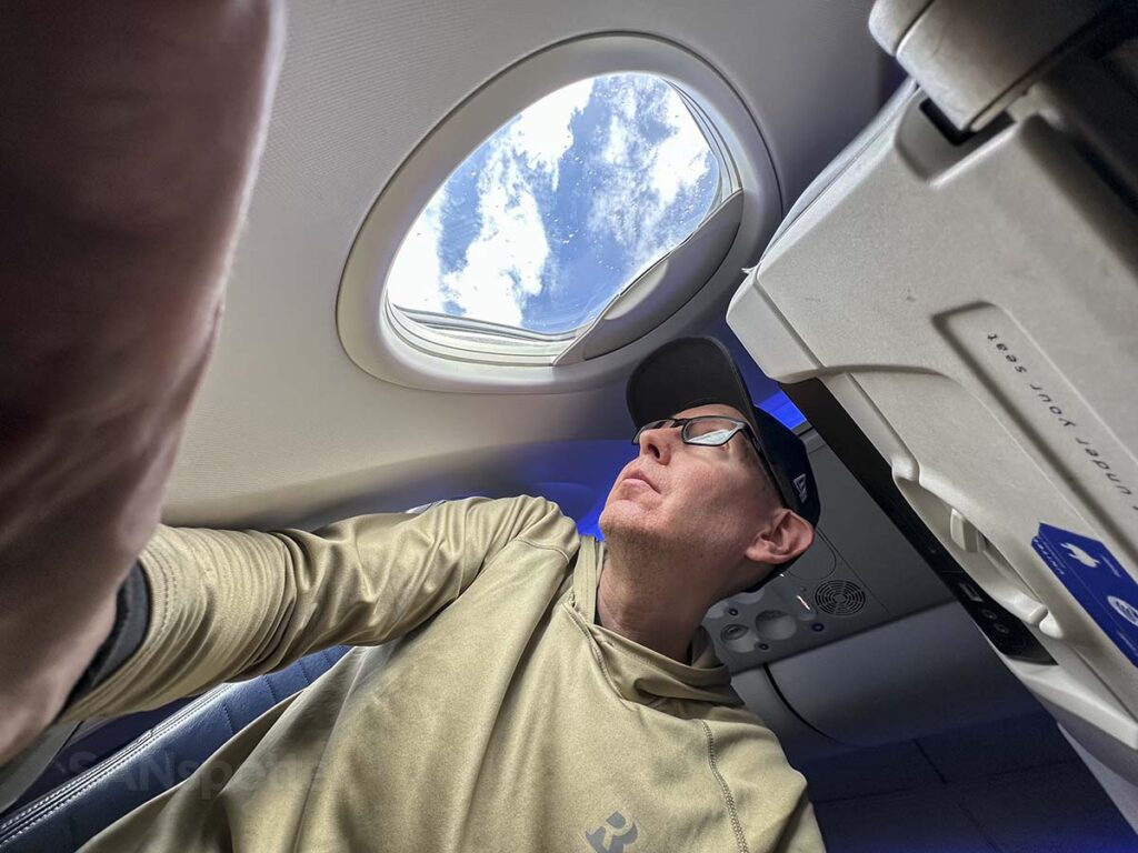 Scott (SANspotter) looking at the window of a United 737 MAX 9 from seat 10F
