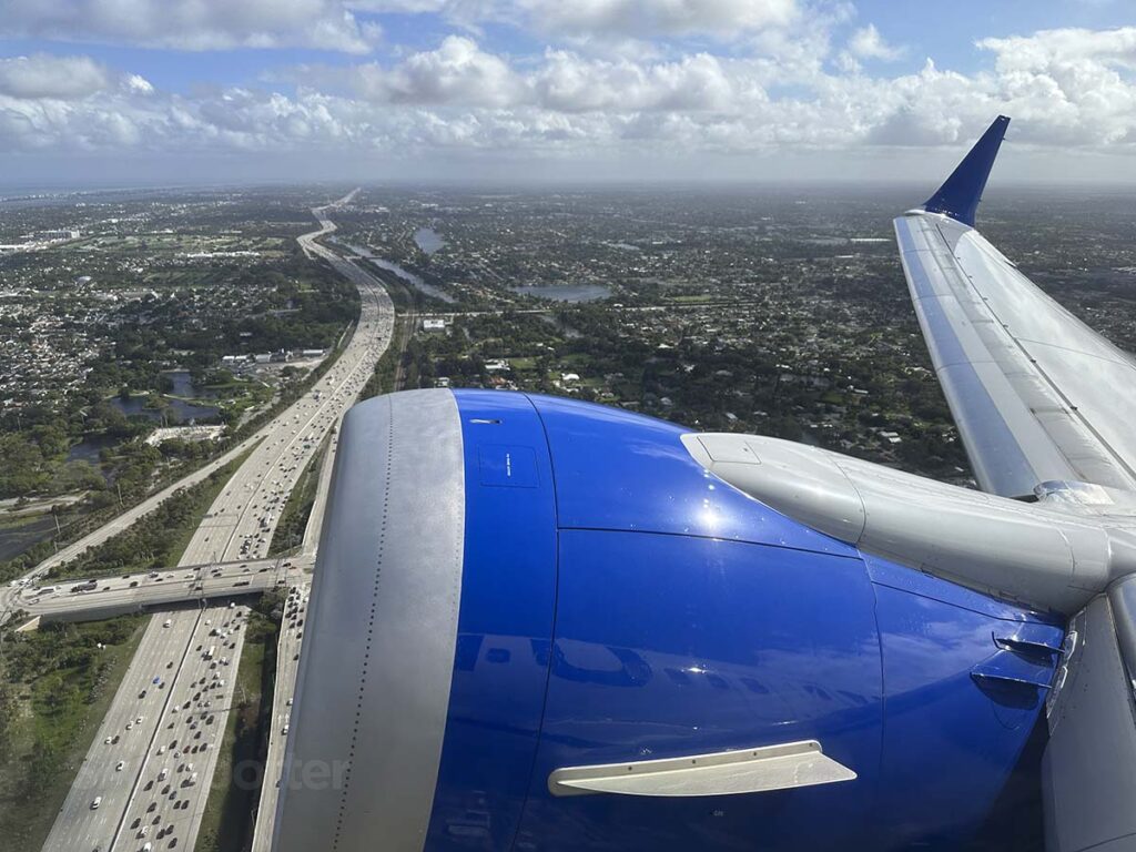 Looking out the window from seat 10F in a United 737 MAX 9 moments after takeoff from runway 10L at PBI