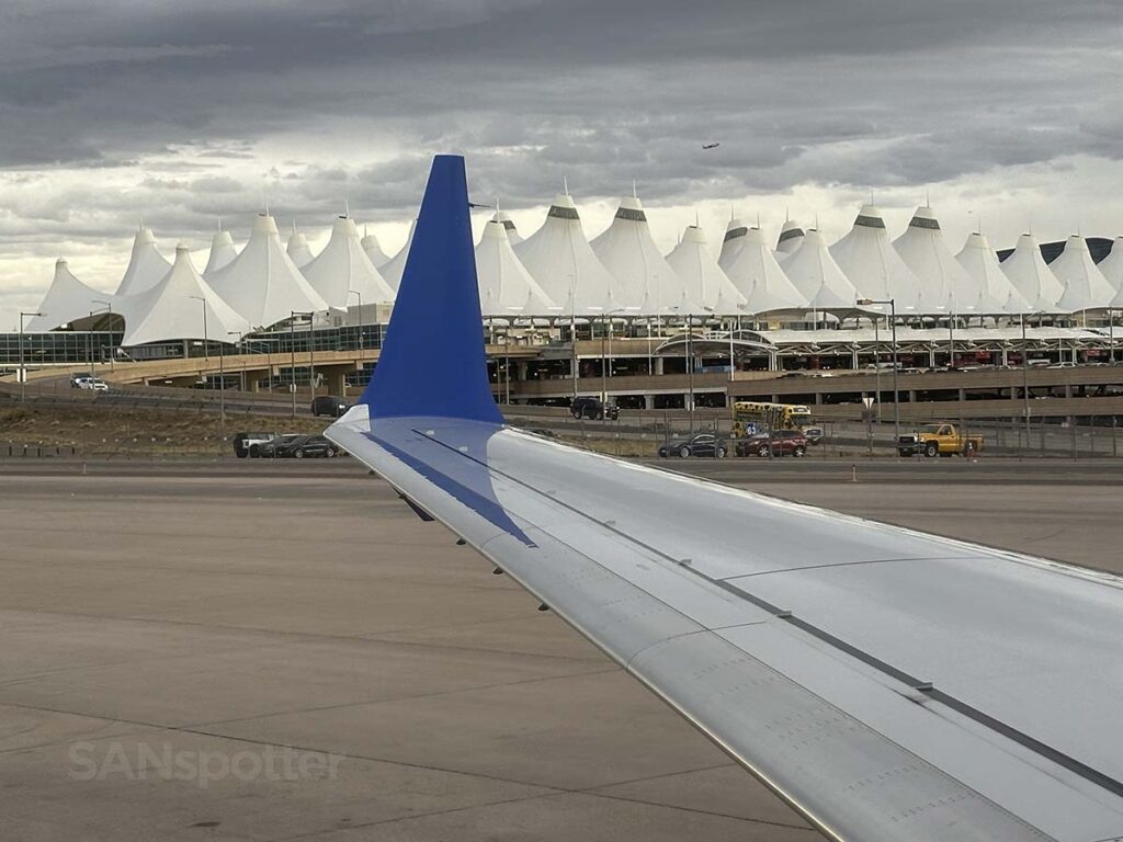United 737 MAX 9 taxiing past the main terminal at the Denver international airport