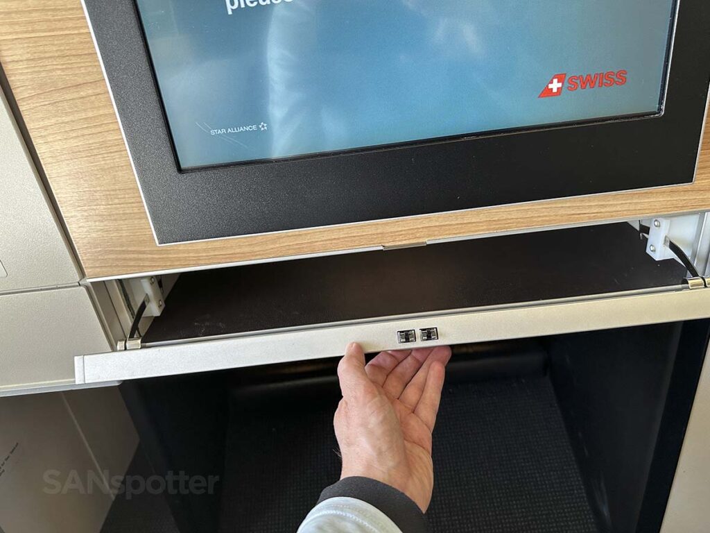 Swiss 777-300ER business class pull out tray under the video screen