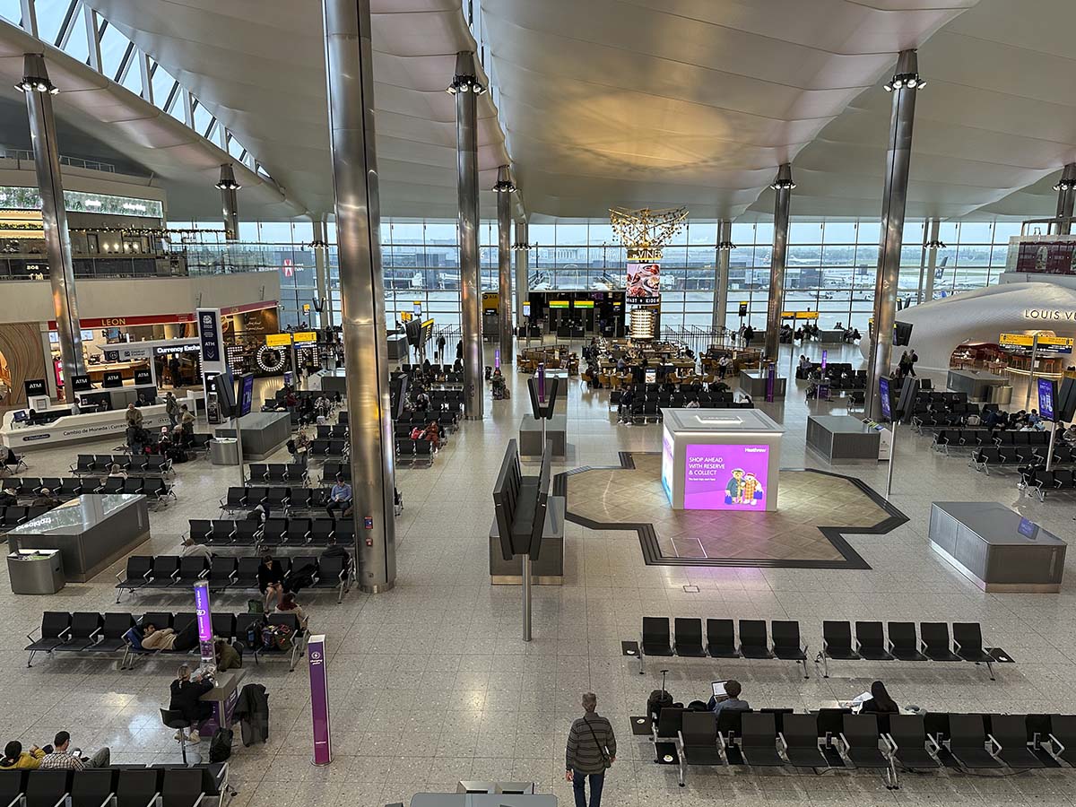 Looking down on the central part of terminal 2 with shops and restaurants at Heathrow Airport