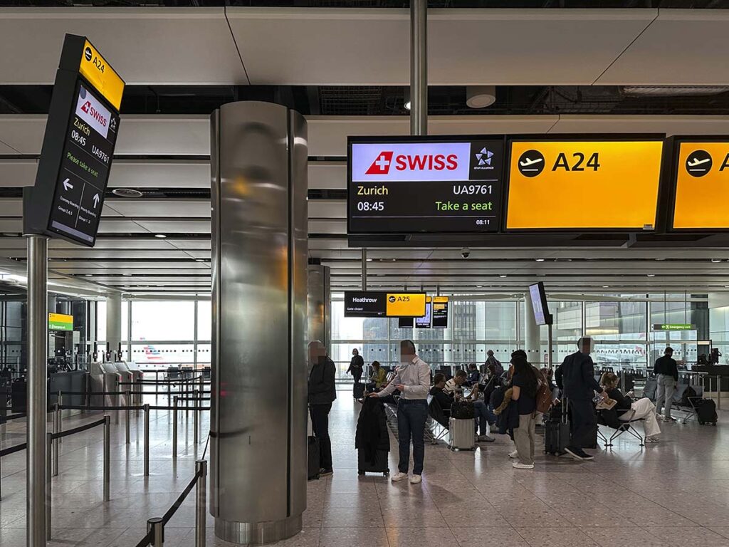 Swiss Airlines gate A24 information display in terminal 2 at LHR