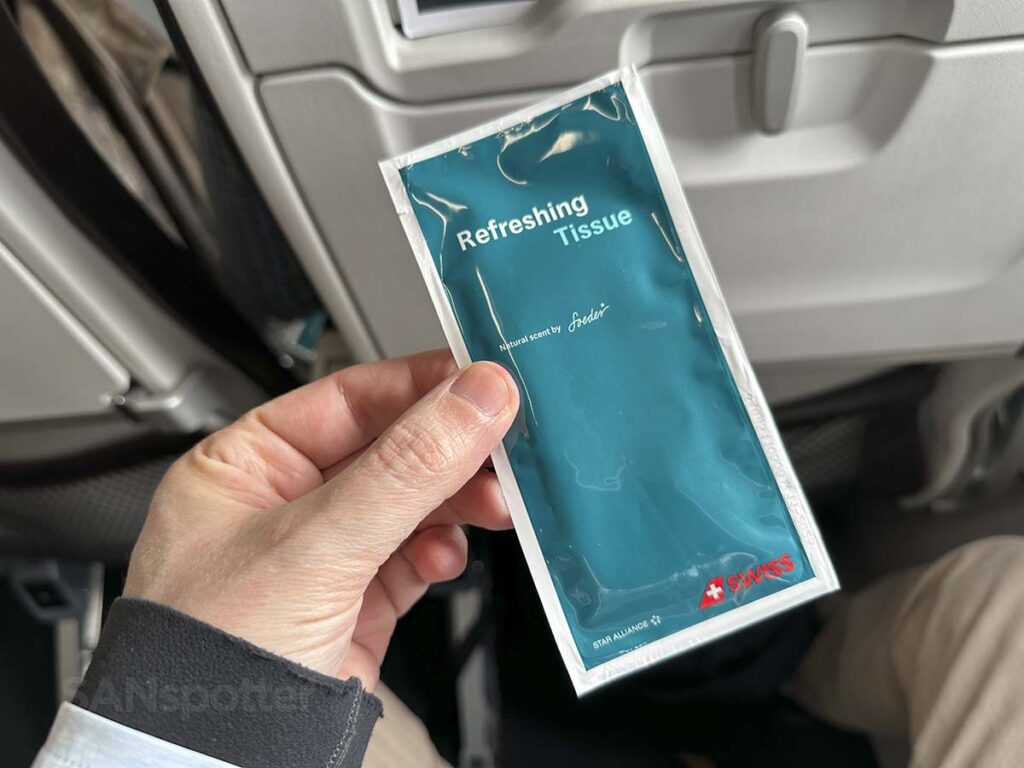 Swiss A320neo business class complementary wet wipe handed out before departure