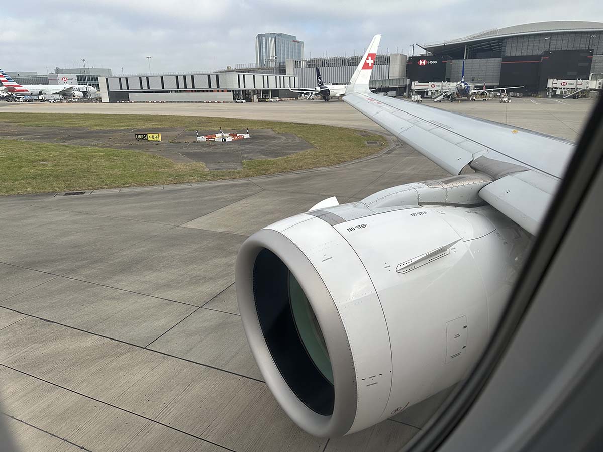 View of engine and wing while looking out the window from seat 3F in a Swiss A320neo