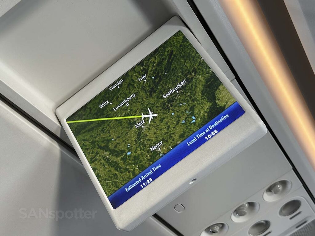 Overhead LCD display showing our position on a map in Swiss A320neo business class