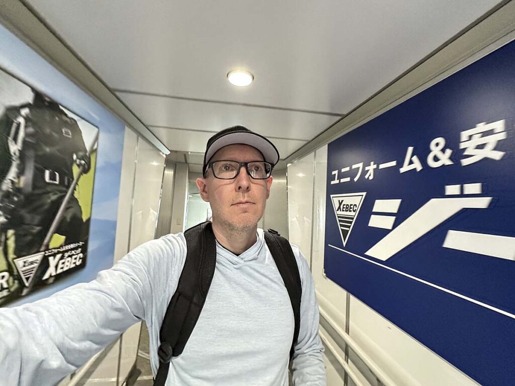Scott Leazenby walking down the jet bridge to gate B Hiroshima Airport