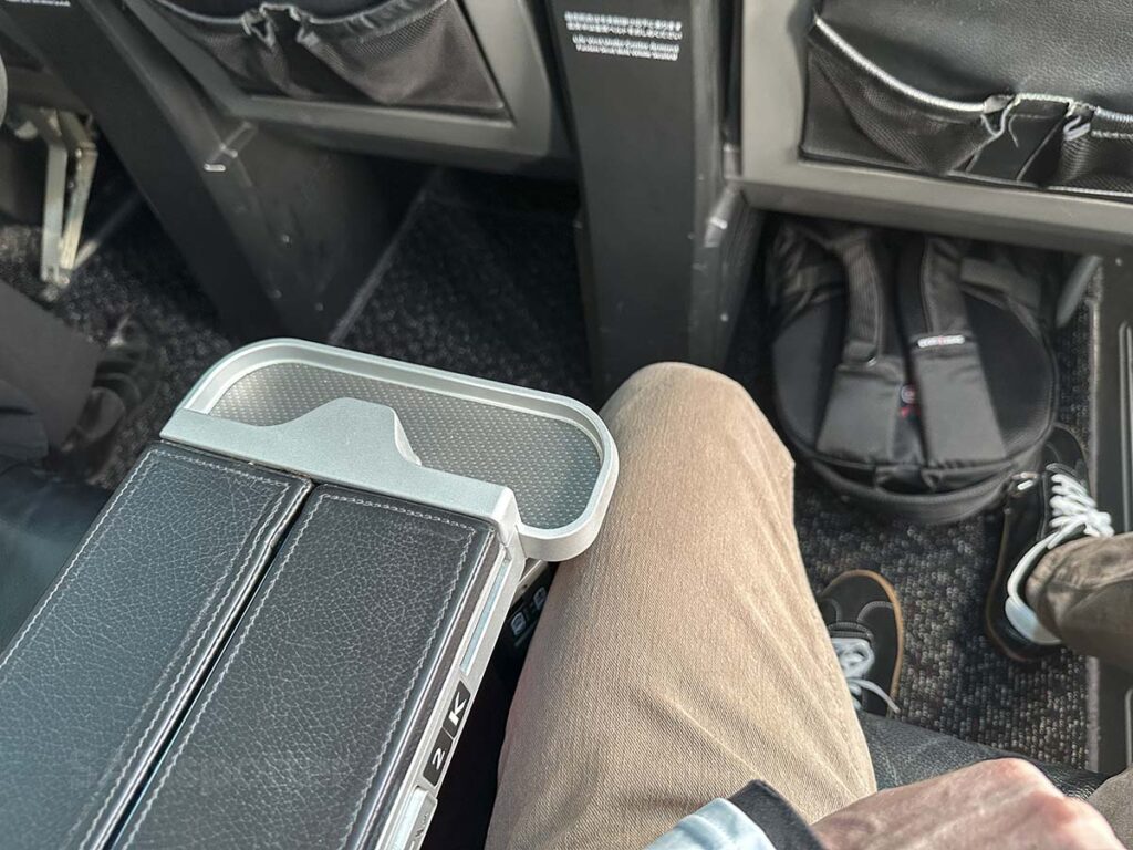 Japan Airlines 737-800 domestic business class center armrest with cup holder and tray table