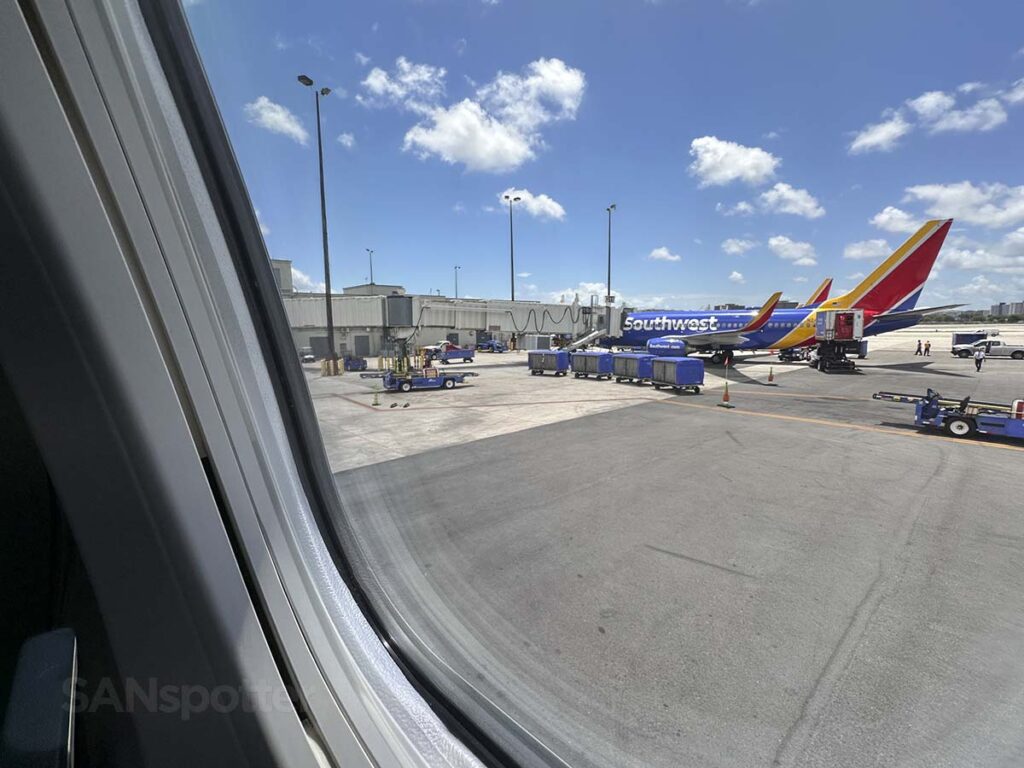 Looking at the window of a Southwest Airlines 737 MAX 8 while pushing back from the gate at the Miami International Airport