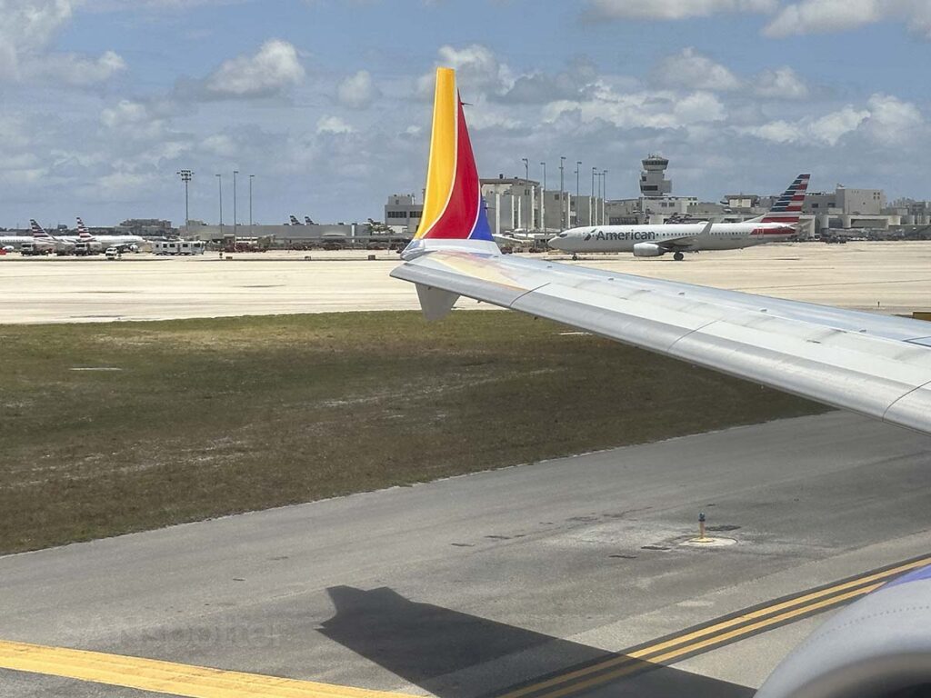 Southwest Airlines 737 MAX 8 wing and winglet as seen from my window while taxing at the Miami International Airport