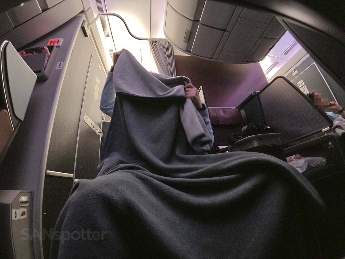 Covering myself with the full-size blanket in JAL A350-1000 Premium Economy
