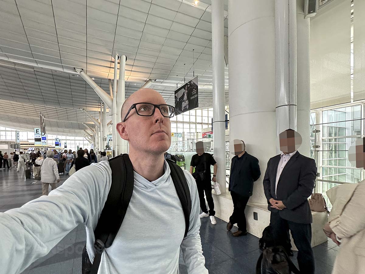 Scott Leazenby walking through the departures hall of Terminal 3 Haneda Airport