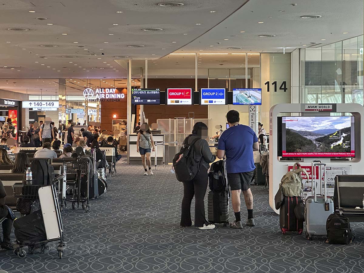 Waiting for the boarding process to begin for JAL flight to Los Angeles at gate 114 terminal 3 Tokyo Haneda airport