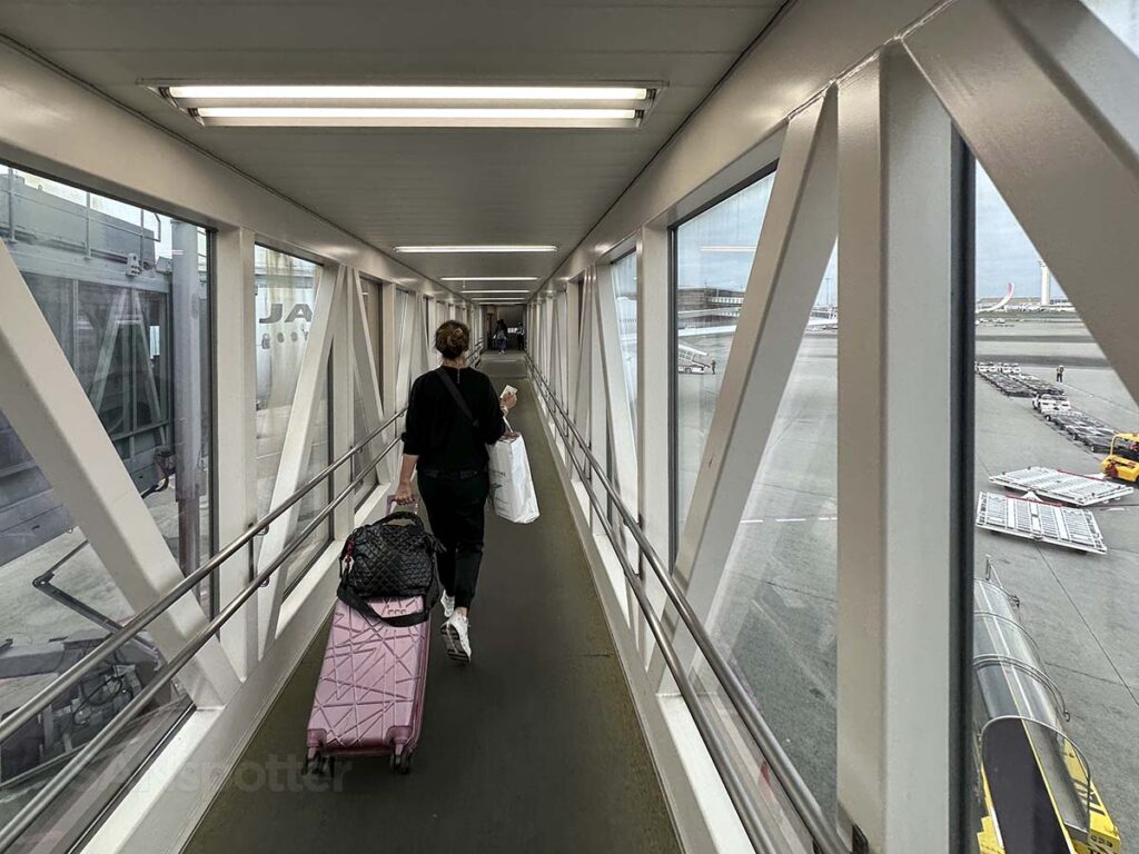 Walking down the jet bridge for gate 114 terminal 3 Tokyo Haneda airport