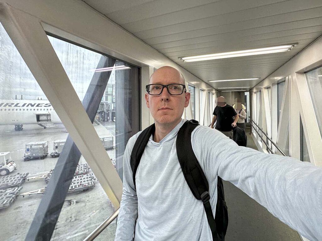 Scott Leazenby walking down the jet bridge at gate 114 terminal 3 Tokyo Haneda airport