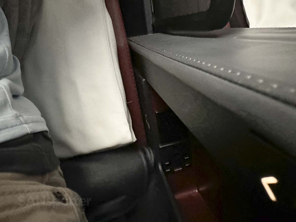 Electrical outlets and USB charging ports under the armrest in JAL A350-1000 premium economy