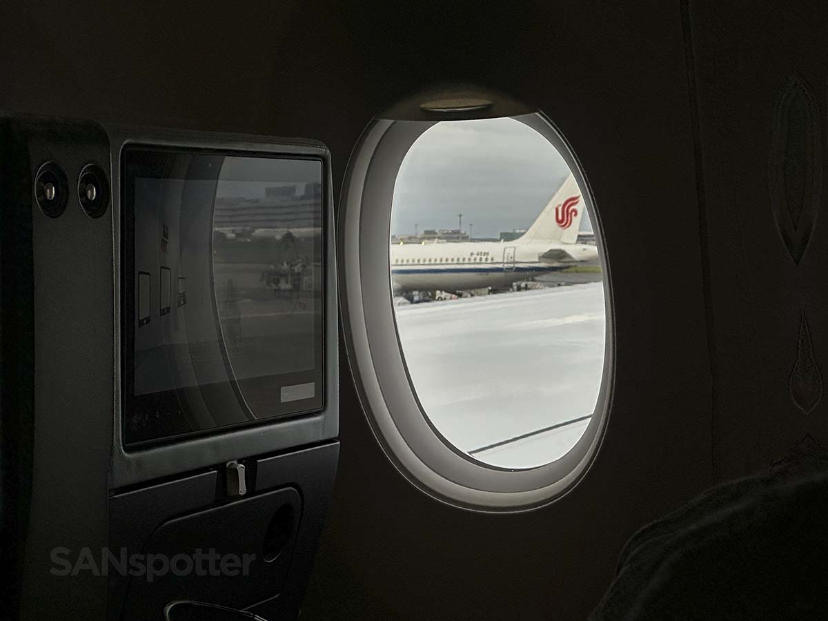 Looking out the window of a JAL A350-1000 while pushing back from the gate at Tokyo Haneda airport