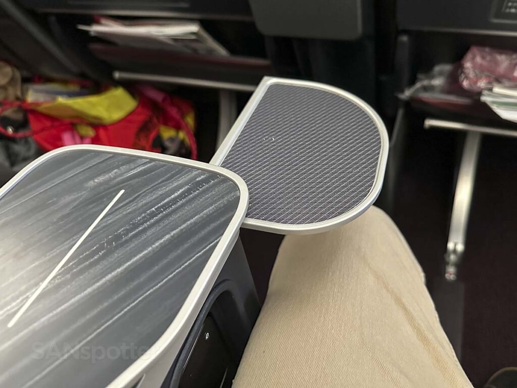 Swing out drink tray coming out of the armrest in JAL A350-1000 premium economy