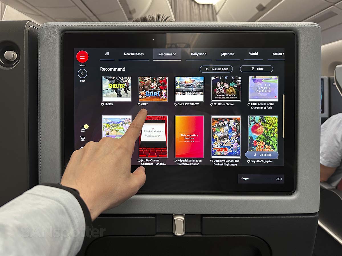 Browsing the recommended movies on the inflight entertainment system in JAL A350-1000 Premium Economy