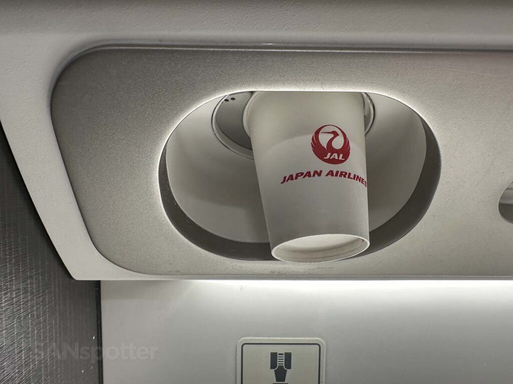 Drinking cups with the Japan Airlines logo in the JAL A350-1000 Premium Economy lavatory