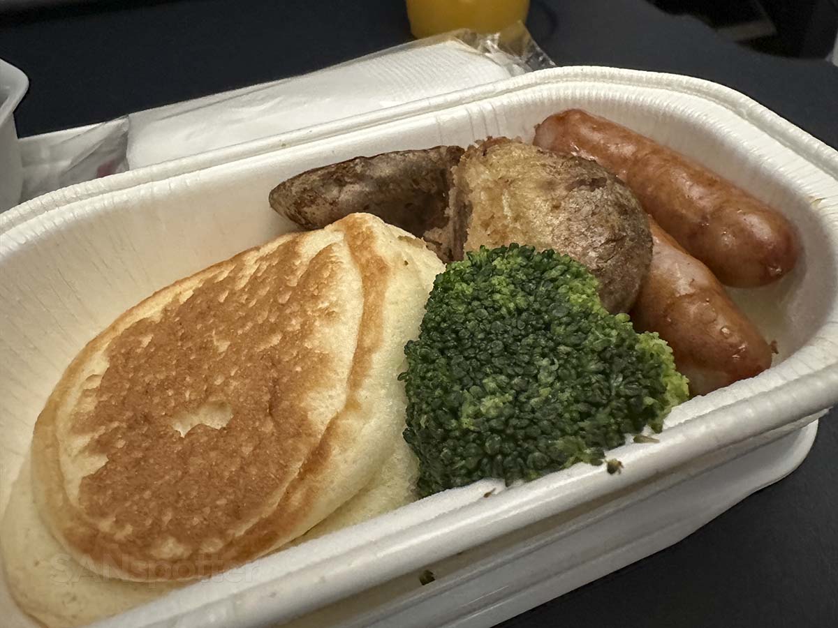 Ricotta pancakes with sausage and potatoes for breakfast in JAL A350-1000 Premium Economy
