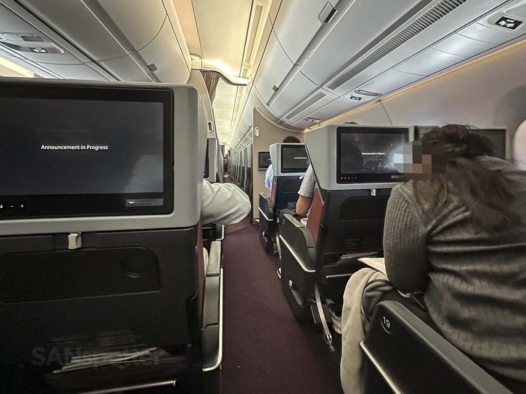 Looking forward from seat 19G in JAL A350-1000 Premium Economy as we taxi to the gate just moments after arrival