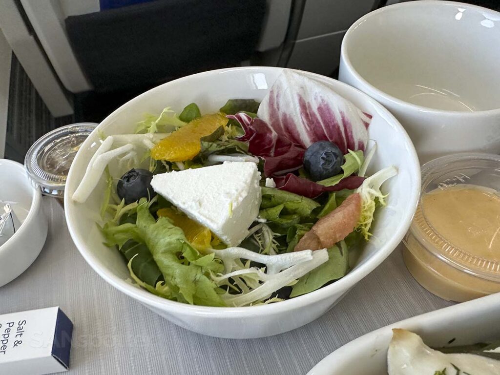 Fresh green salad with mozzarella cheese served with my meal in Korean Air 737 MAX 8 business class 