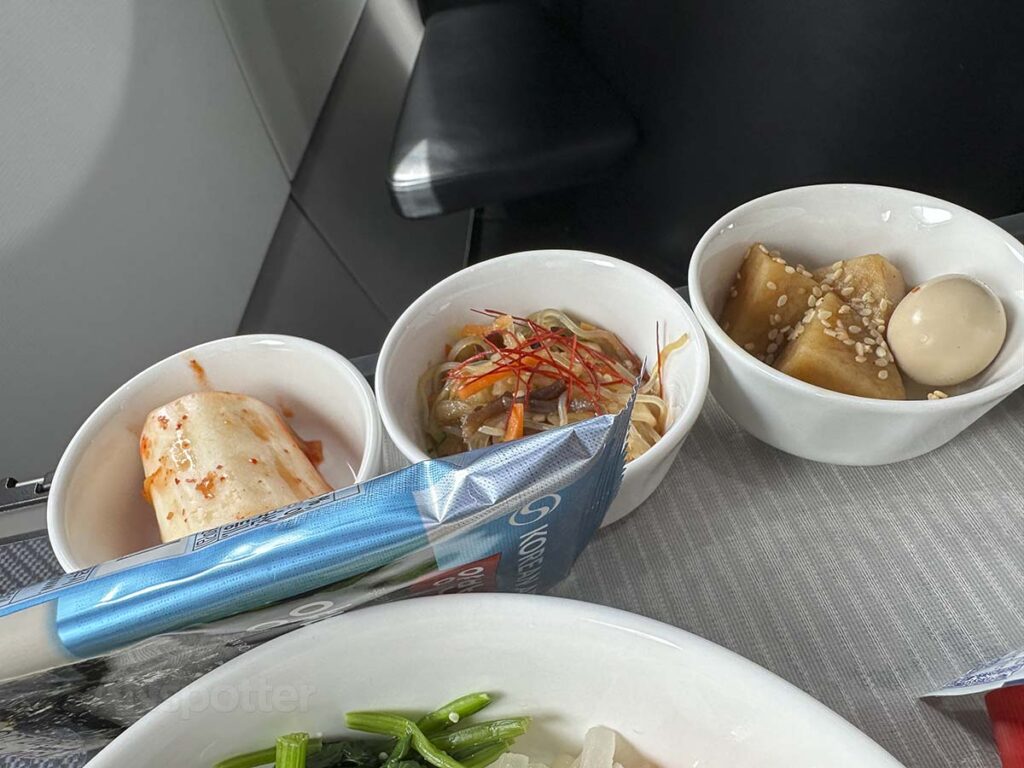 Korean Air A321neo business class side dishes including kimchi that comes with the Bibimbap lunch tray
