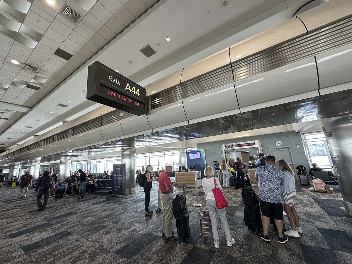 Passengers lining up to board in Alaska Airlines flight to San Diego flight at gate A44 at the Denver International Airport