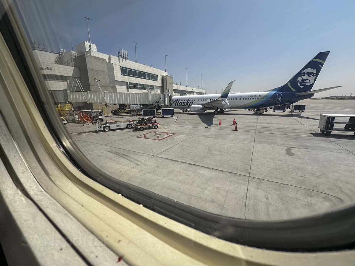 Alaska Airlines Aircraft parked at concourse A Denver International Airport