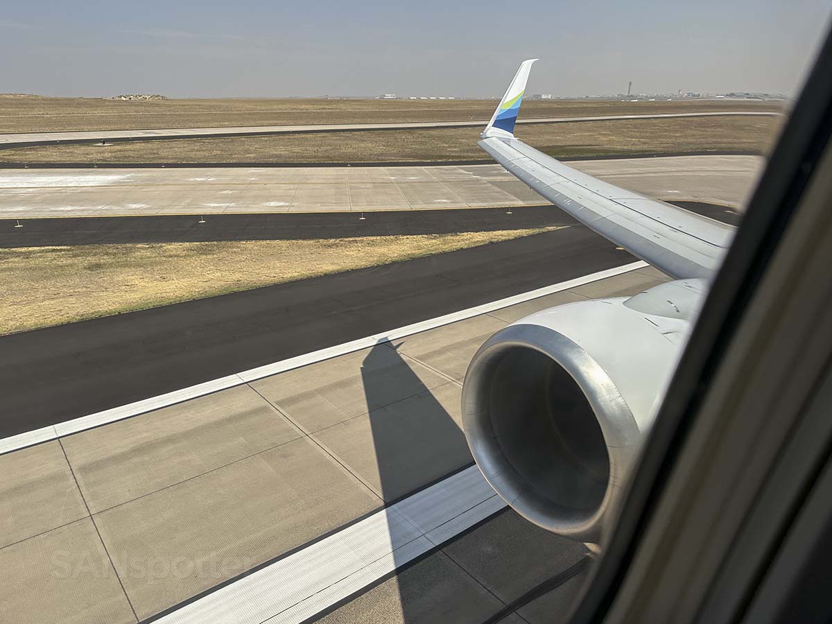 Alaska Airlines 737-800 rolling down runway 25 at the Denver International Airport for departure
