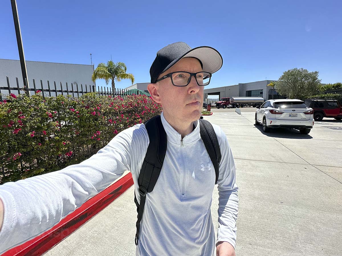 Scott Leazenby walking into the Carlsbad Jet Center at the McClellan-Palomar Airport