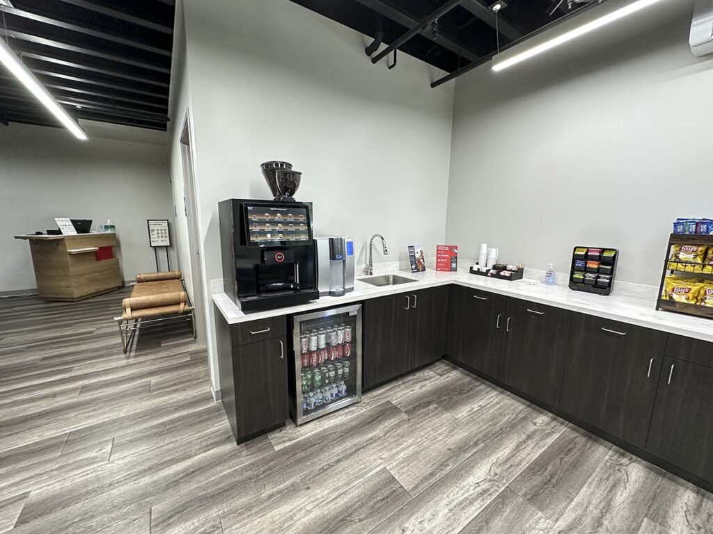 JSX lounge area with complementary drinks and snacks in the Carlsbad Jet Center at the McClellan-Palomar Airport