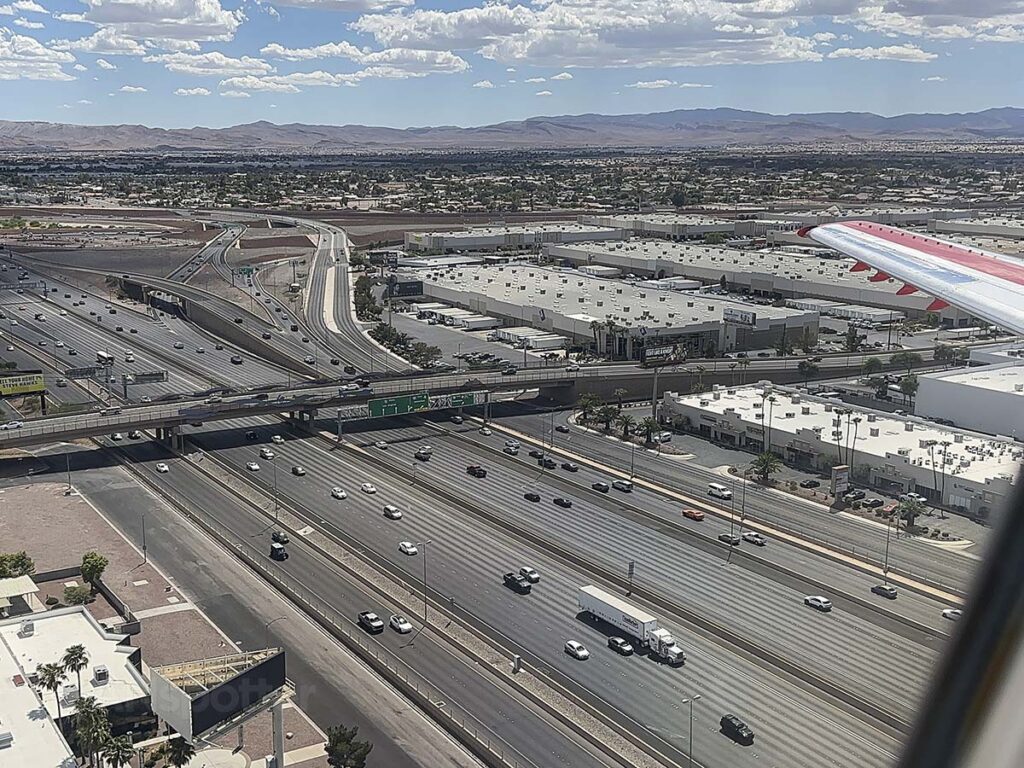 Looking out the window of a JSX E145 while on short final for the Las Vegas airport