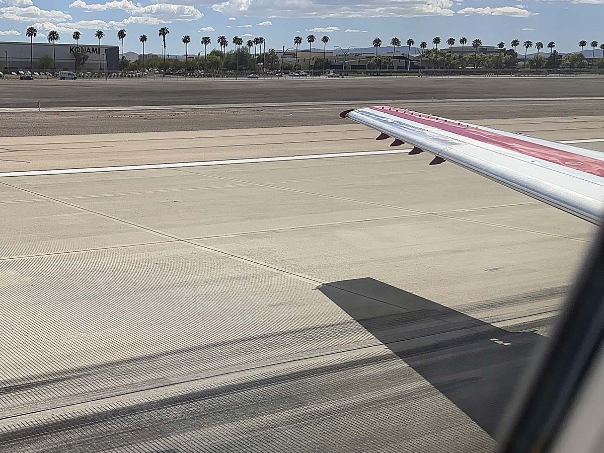 Looking out the window of a JSX E145 while touching down on runway 08R at LAS