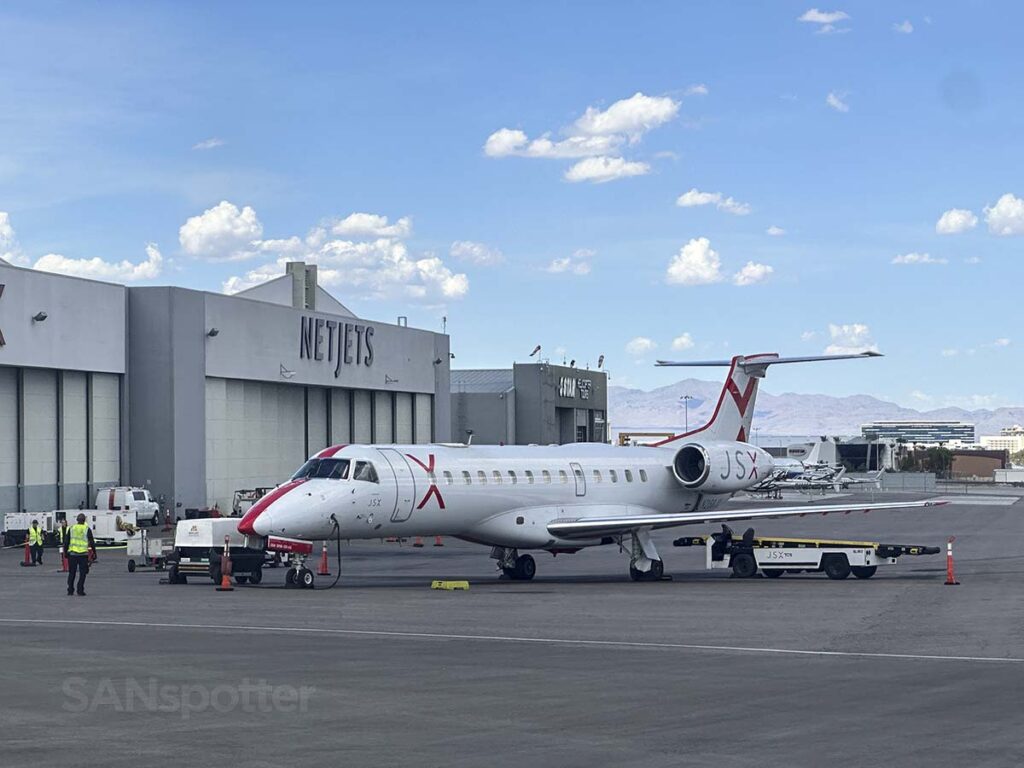 The Netjets building at LAS with a JSX E135 parked next to it