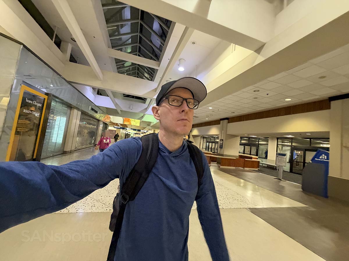 Scott Leazenby looking disgusted while walking through the Honolulu International Airport