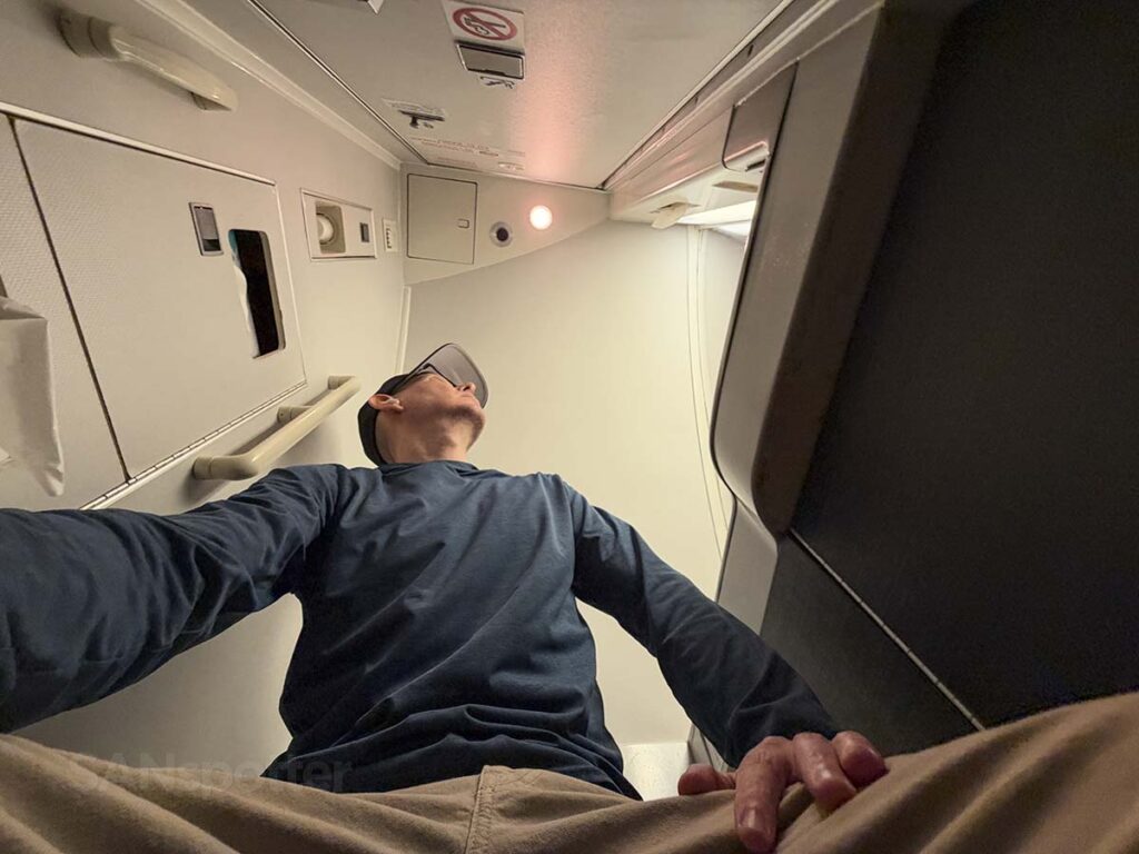 Sitting on the toilet in the first class lavatory on a United Airlines 757-300