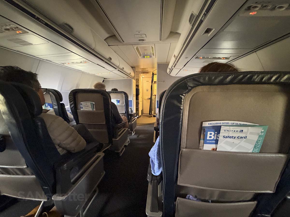 Looking up the aisle of United Airlines 757-300 first class from row 4