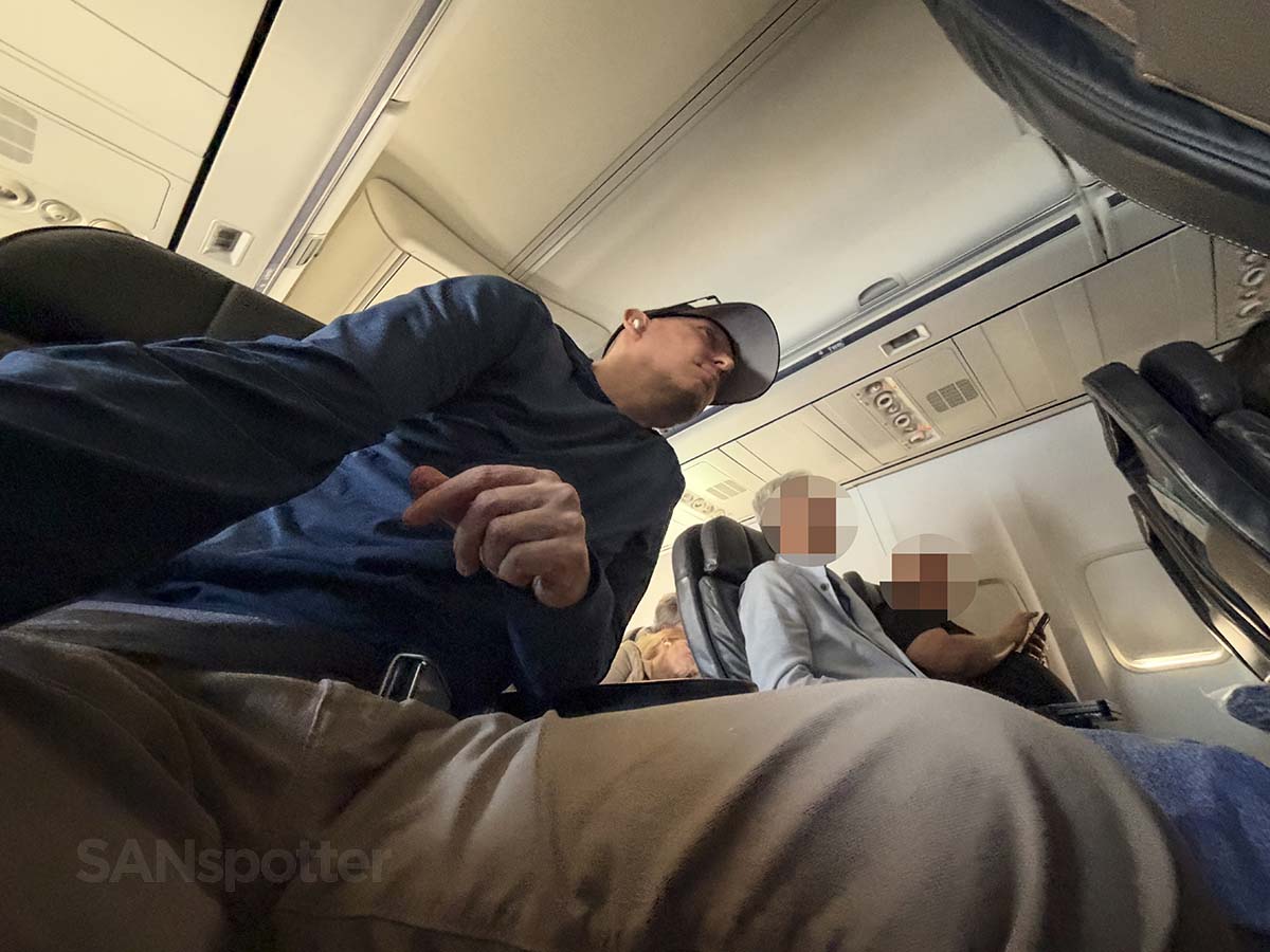 Scott Leazenby licking up the aisle towards the cockpit from his seat in United Airlines 757-300 first class