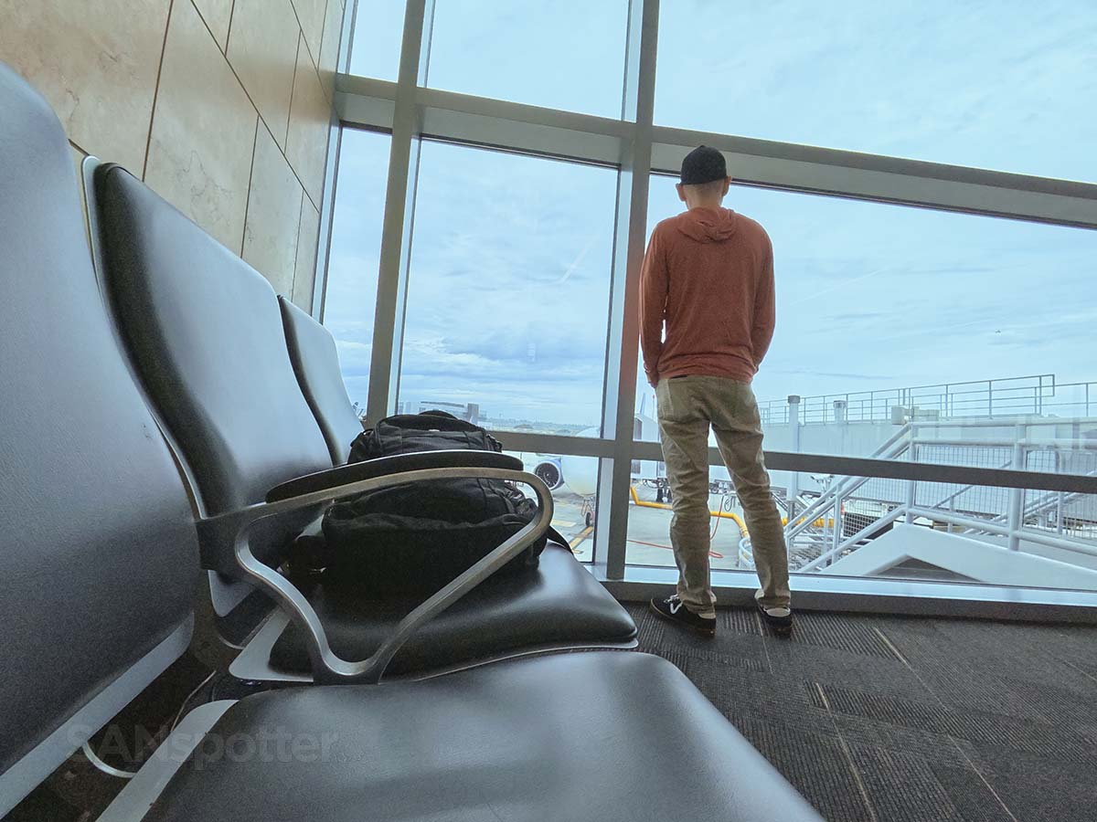 Scott Leazenby looking out the window watching the ground crew prepare a United Airlines A321XLR for a flight back to Washington Dulles at gate 45 San Diego airport